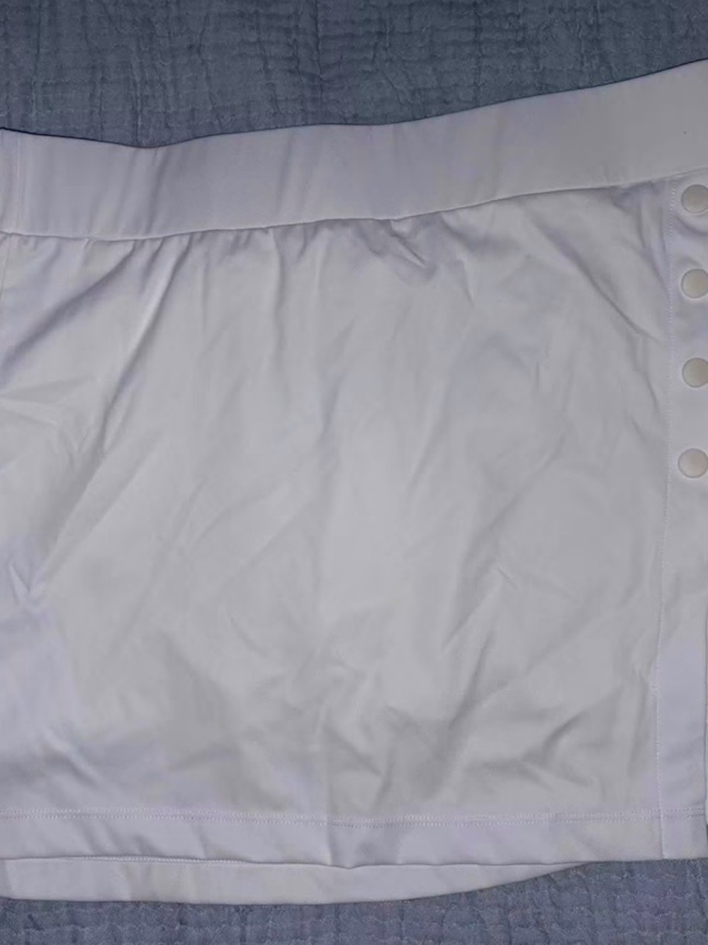 HALARA White Mini Skirt with Side Button Detail